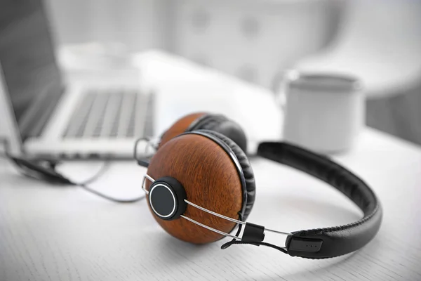 Headphones and laptop on table