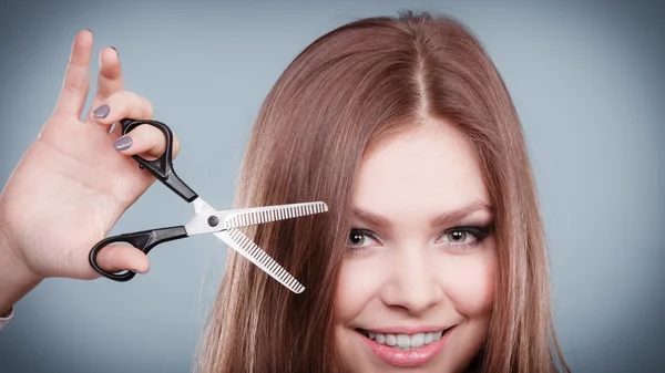 Professional hairdresser with scissors