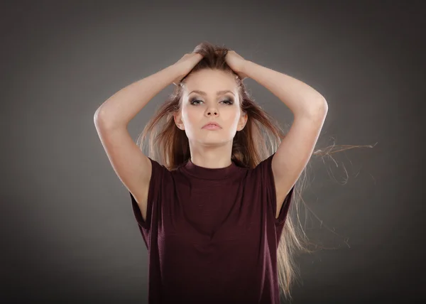 Glamorous stunning woman with waving hair.