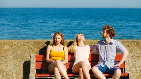 Three happy young people friends outdoor.