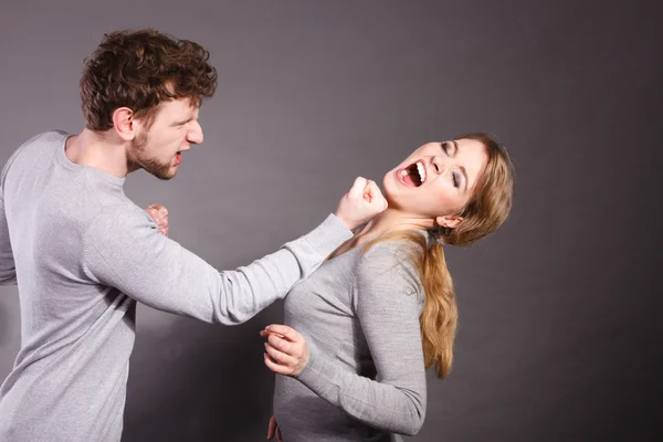 Aggressive man yelling on woman.