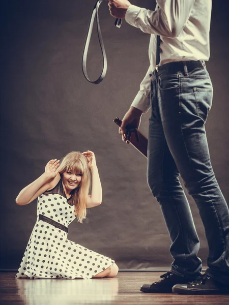 Man alcoholic beating his scared woman with belt