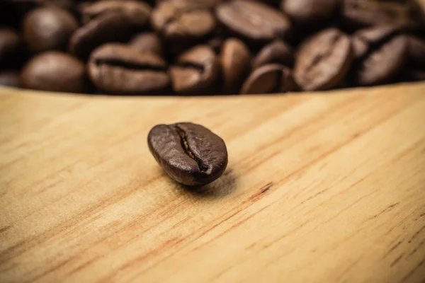 Coffee beans on wooden board