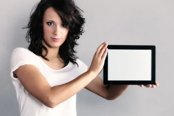 Sexy girl showing copy space on tablet touchpad