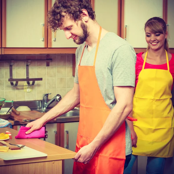 Couple woman and man cooking in kitchen.