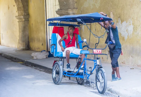 A Cuban rickshaw driver