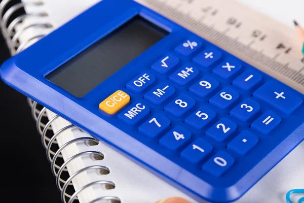 Calculator and Office supplies close-up