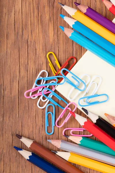 Set of colored pencils and paper clips