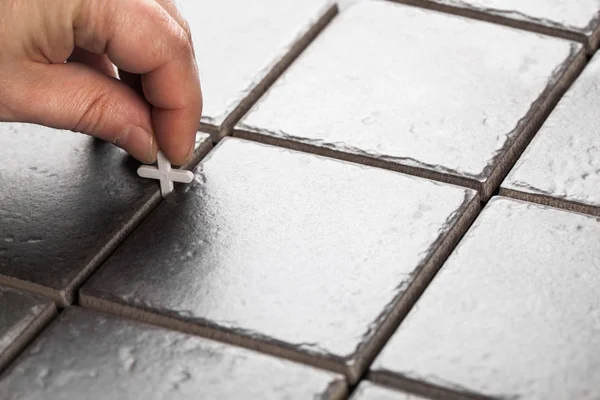 Laying of ceramic tiles