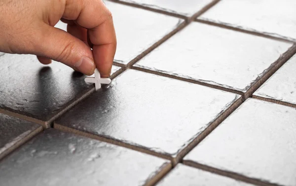 Laying of ceramic tiles
