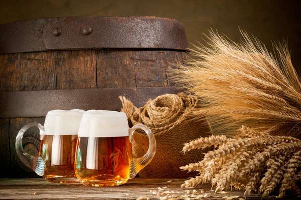 Two beer glasses with wheat and barley