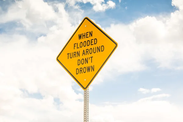 When flooded turn around. Road sign