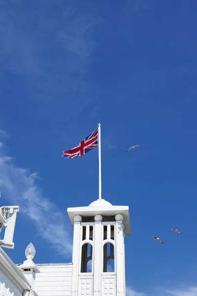Tower with flag in Brighton Pier in East Sussex