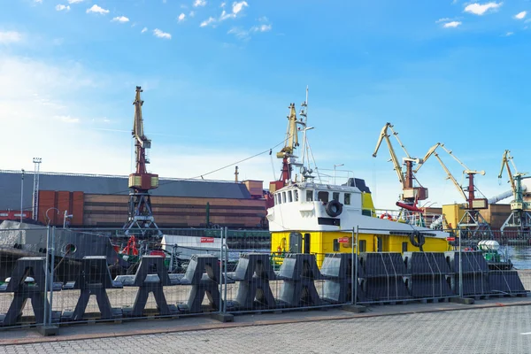 Dry cargo vessel and lifting cranes at Marina in Ventspils