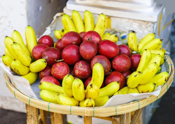 Asian street farmer market selling fresh banana and passion fruit