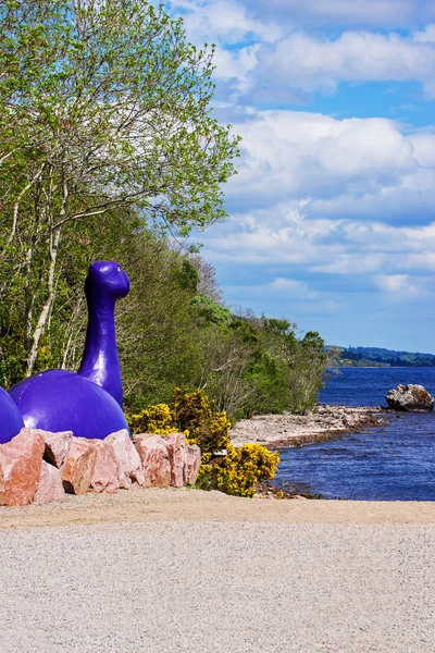 Loch ness monster figure in Loch Ness in Scotland