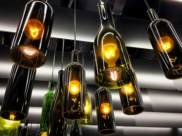Beautiful retro light lamps decoration made of wine bottles