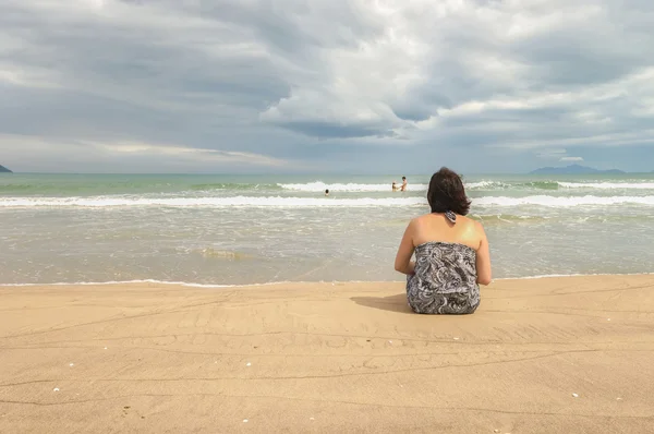 Woman looking at the sea at the China Beach Danang