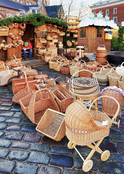 Straw baby carriage and baskets at the Riga Christmas market