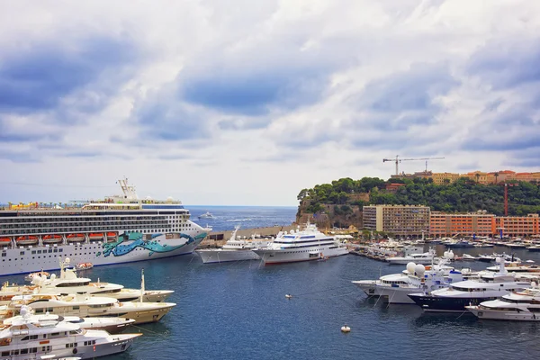 Cruise liner in Port Hercule, luxury ships and palace on the mou