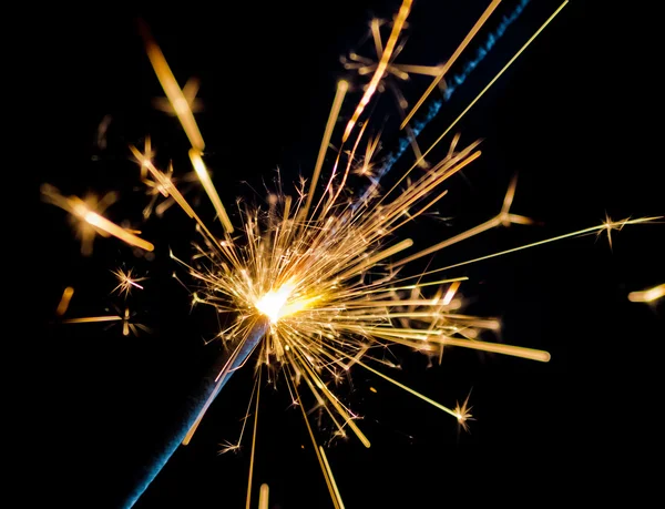 Firework sparkler burning on black background, congratulation greeting  party happy new year,  christmas celebration
