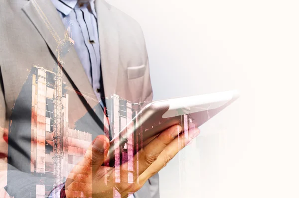 Double exposure of Architect or Business Man use Mobile Tablet w