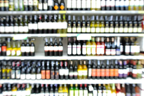Abstract Blur or Defocus Background of Bottles of Wine on Shelf