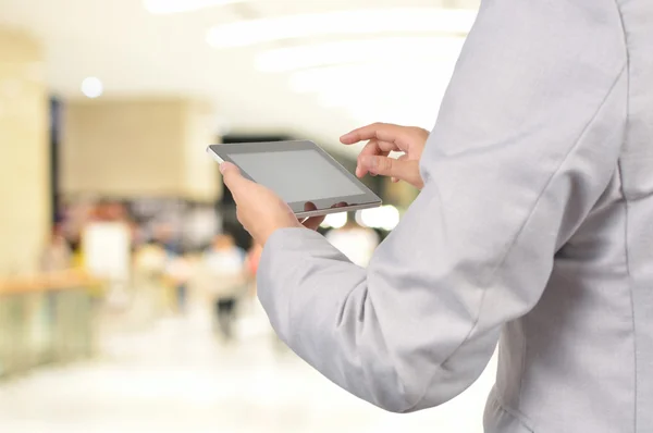 Handsome young man in Modern Building using mobile Tablet PC