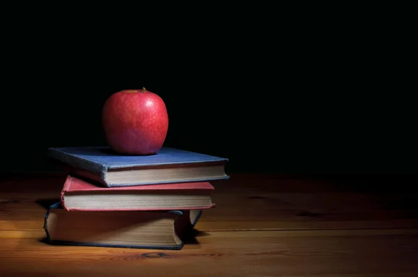 Apple with books