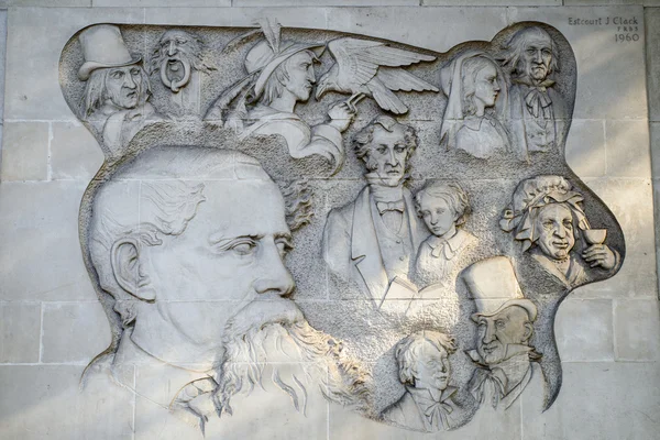 Bas Relief Carving of Charles Dickens Characters in London