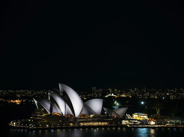 Sydney city harbour with opera house at night in australia