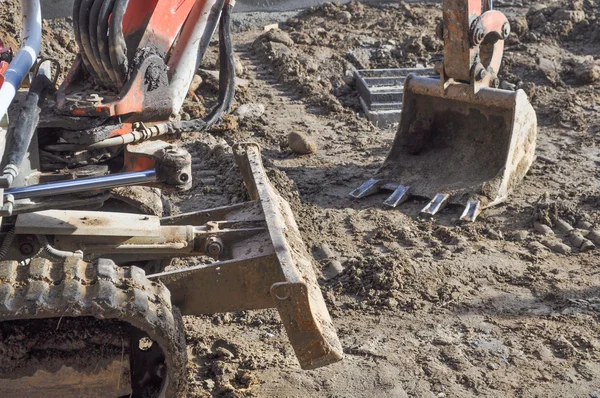 Excavator digging a hole