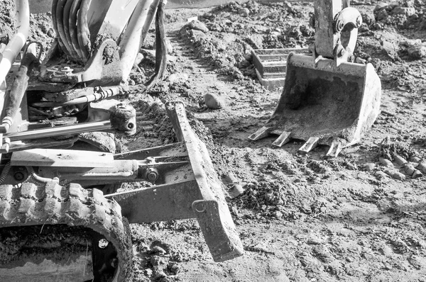 Excavator digging a hole
