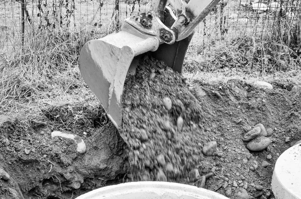 Excavator digging a hole