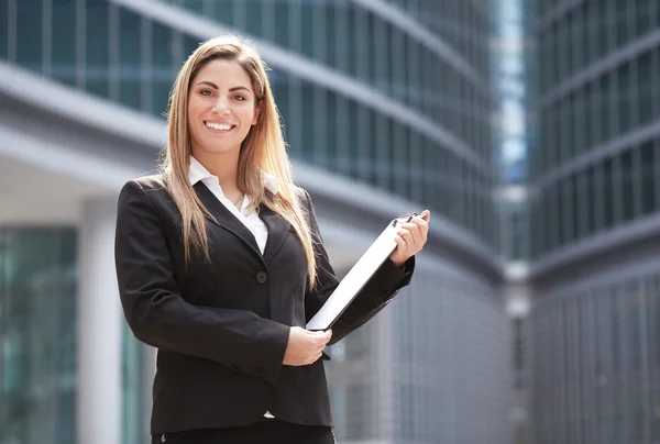 Businesswoman standing in front of the building