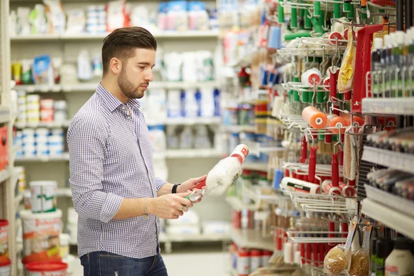 Young man working in a hardware store