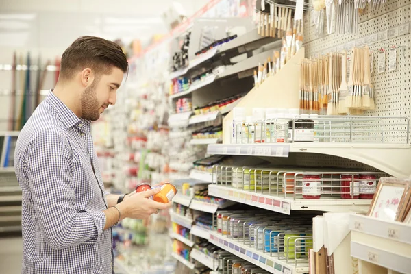 Young man working in a hardware store