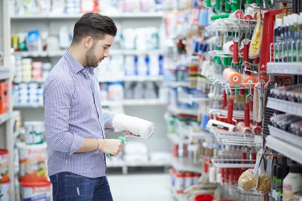 Young man working in hardware store