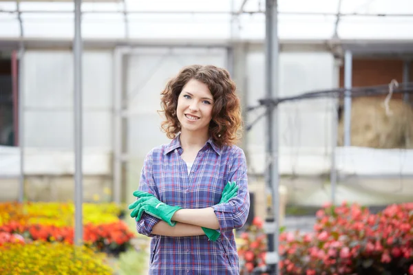 Young lady working in a plant nursery