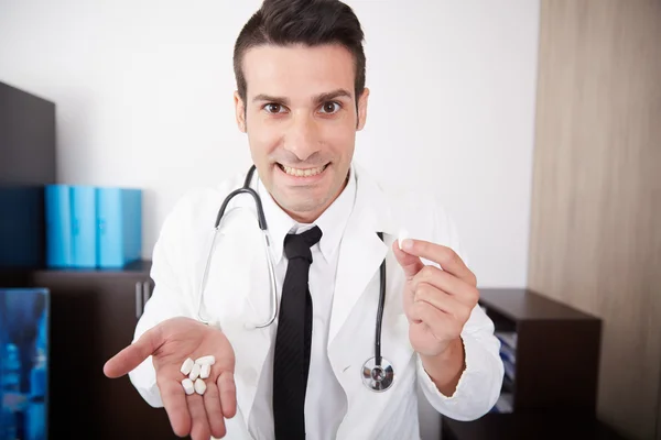 Crazy doctor  showing pills