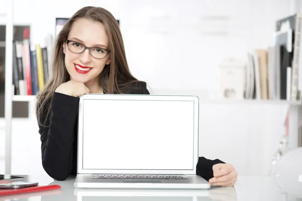 Business woman showing blank laptop screen