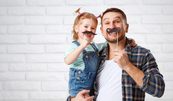 Funny family father and child with a mustache