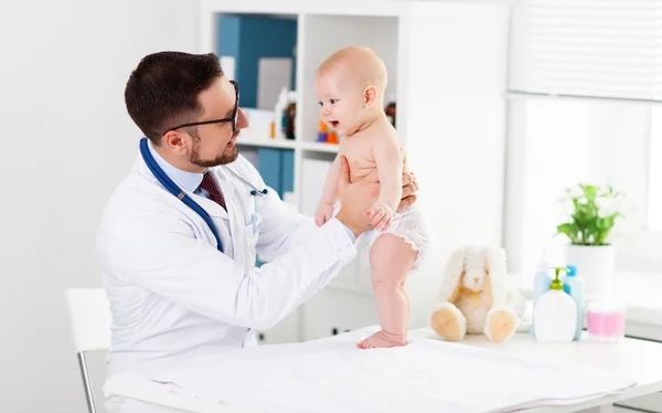 Doctor pediatrician with baby child