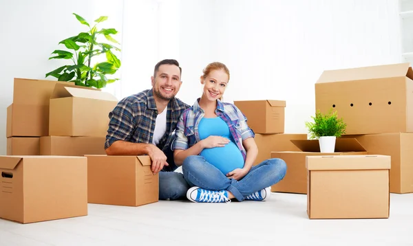 Moving to new apartment. family pregnant wife and husband with