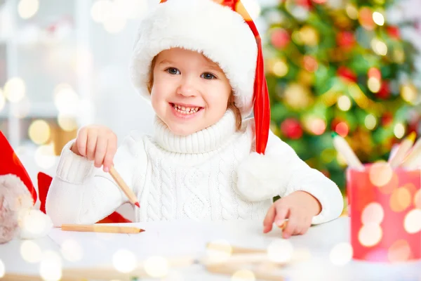 Child before Christmas writes a letter to Santa