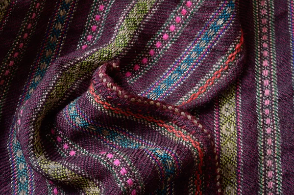 Close-up of the homespun woolen wrinkled