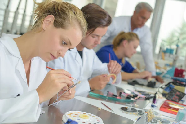 Woman working in dental laboratory