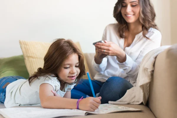 Girl painting in the living room