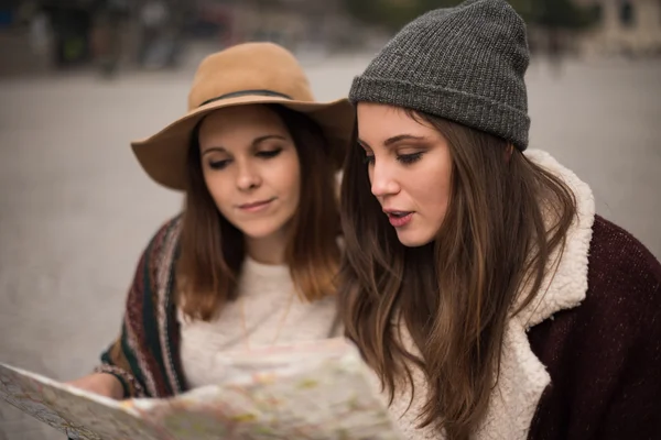 Friends looking at city map