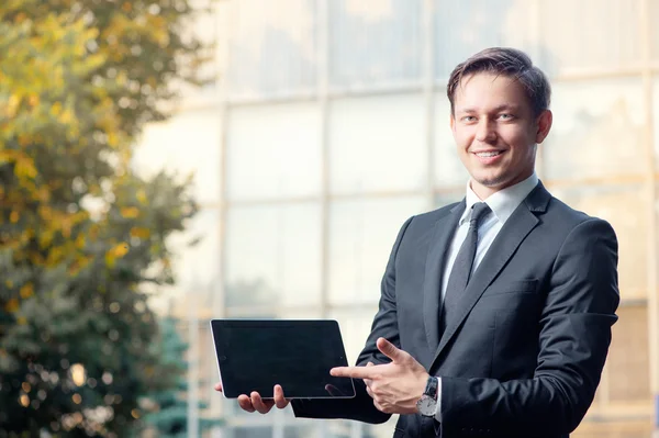 Man showing a screen of digital tablet